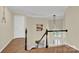 View of staircase with hardwood floors and a glimpse of the entryway at 8534 Headford Rd, Charlotte, NC 28277