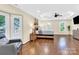 Spacious main bedroom with hardwood floors, a large bed, and bay windows at 8534 Headford Rd, Charlotte, NC 28277