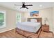 Bright bedroom with a king-size bed, nightstands, and hardwood floors at 8534 Headford Rd, Charlotte, NC 28277
