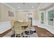 Formal dining room with hardwood floors and a chandelier at 8534 Headford Rd, Charlotte, NC 28277