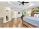 Main bedroom with hardwood floors, a large bed, and a walk-in closet at 8534 Headford Rd, Charlotte, NC 28277