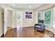 Relaxing sitting area with hardwood floors, a recliner, and access to a bathroom at 8534 Headford Rd, Charlotte, NC 28277