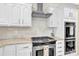 Modern kitchen with stainless steel appliances and white cabinetry at 8534 Headford Rd, Charlotte, NC 28277
