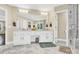 Double vanity bathroom with marble countertops and ample storage at 8534 Headford Rd, Charlotte, NC 28277