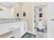 Updated bathroom with double vanity and tiled flooring at 8534 Headford Rd, Charlotte, NC 28277