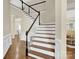 Elegant staircase with dark wood and white railings at 8534 Headford Rd, Charlotte, NC 28277