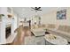 Open living room featuring hardwood floors and a cozy fireplace at 8534 Headford Rd, Charlotte, NC 28277