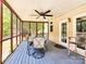 Cozy screened porch with dining table and ceiling fan at 8534 Headford Rd, Charlotte, NC 28277