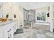 Elegant bathroom featuring a soaking tub and walk-in shower at 8534 Headford Rd, Charlotte, NC 28277