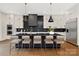 Stylish kitchen boasting a large island, dark countertops, and high-end appliances at 518 Ideal Way, Charlotte, NC 28203