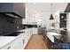 Gourmet kitchen with white cabinets, a large island, and modern fixtures at 518 Ideal Way, Charlotte, NC 28203