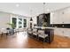 Modern kitchen with dark cabinetry, marble countertops, and stainless steel appliances at 518 Ideal Way, Charlotte, NC 28203