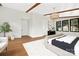 Spacious primary bedroom with hardwood floors, high ceilings, and large windows at 518 Ideal Way, Charlotte, NC 28203