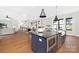 Open concept kitchen with an island, stainless steel appliances, and a view into the living area at 518 Ideal Way, Charlotte, NC 28203