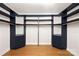 Spacious walk-in closet with custom built-in shelving and drawers at 518 Ideal Way, Charlotte, NC 28203
