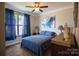 Serene bedroom featuring blue bedding and artwork at 124 Rosebay Dr, Mooresville, NC 28117