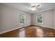 Bedroom with hardwood floors and two windows at 866 Concord Rd, Davidson, NC 28036