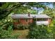 Brick home exterior showcasing a screened porch at 866 Concord Rd, Davidson, NC 28036