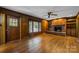 Gathering room with wood paneling, fireplace and built-in shelving at 866 Concord Rd, Davidson, NC 28036
