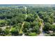 Aerial view of property showing wooded area and home at 866 Concord Rd, Davidson, NC 28036