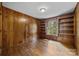 Bedroom with wood paneled walls and built-in shelving at 866 Concord Rd, Davidson, NC 28036