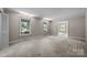 Spacious living room with carpet and large windows at 866 Concord Rd, Davidson, NC 28036
