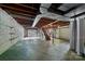 Unfinished basement with high ceilings and storage shelving at 866 Concord Rd, Davidson, NC 28036