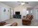 Relaxing living room with vaulted ceiling, brown sofas and a TV stand at 157 Woodrun Dr, Mount Gilead, NC 27306