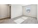 Spacious bedroom with gray carpeting and window at 1534 Harper Landing Blvd, Stanley, NC 28164