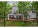 Lakefront home with expansive deck and lush landscaping at 80 Fairview Farms Rd, Shelby, NC 28150