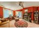 Cozy Gathering room with a fireplace, hardwood floors, and built-in shelving at 80 Fairview Farms Rd, Shelby, NC 28150