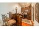 Wet bar with custom cabinetry, wine rack, and seating for two at 80 Fairview Farms Rd, Shelby, NC 28150