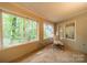 Relaxing sunroom with stone flooring and views of the surrounding nature at 80 Fairview Farms Rd, Shelby, NC 28150
