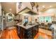 Well-equipped kitchen boasts an island, custom cabinetry, and hardwood floors at 80 Fairview Farms Rd, Shelby, NC 28150