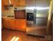 Kitchen with stainless steel refrigerator, built-in oven, and wood cabinets at 115 Sunrise Cir, Shelby, NC 28150