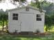 White shed with double doors and two windows at 115 Sunrise Cir, Shelby, NC 28150