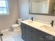 Double vanity bathroom with gray cabinets and marble floors at 2858 Paul Payne Store Rd, Taylorsville, NC 28681