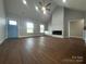 Spacious living room with hardwood floors, fireplace, and high ceilings at 2858 Paul Payne Store Rd, Taylorsville, NC 28681