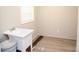 Laundry room with sink and vinyl flooring at 2574 Orchard Rd, Smyrna, SC 29743
