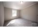 Bright bedroom featuring neutral walls and plush carpeting at 2574 Orchard Rd, Smyrna, SC 29743