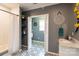 Modern bathroom with white subway tile, updated fixtures and a patterned tile floor at 114 Market St, Rockwell, NC 28138