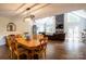 Light-filled dining area adjacent to the living room with hardwood floors at 114 Market St, Rockwell, NC 28138
