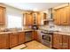 Kitchen features stainless steel appliances and wood cabinets at 114 Market St, Rockwell, NC 28138