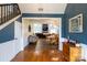 Bright and spacious entryway with hardwood floors, and views into the living and dining areas at 114 Market St, Rockwell, NC 28138