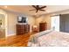 Spacious bedroom with hardwood floors, large dresser, and a walk-in closet at 114 Market St, Rockwell, NC 28138