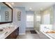 Elegant bathroom with double sinks, soaking tub, and a glass shower at 114 Market St, Rockwell, NC 28138