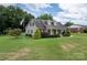Charming one-story home with landscaped lawn and attached garage at 114 Market St, Rockwell, NC 28138