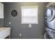 Convenient laundry room with washer, dryer, and utility sink at 114 Market St, Rockwell, NC 28138