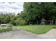 Large backyard with playground set and plenty of space for outdoor fun at 114 Market St, Rockwell, NC 28138