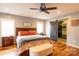 Bright bedroom with hardwood floors, king-size bed, and a walk-in closet at 114 Market St, Rockwell, NC 28138